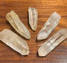 Science & Origin of Lemurian Seed Crystal Lemurian Seed Crystal, also known as Lemurian Quartz. These are a special variety of Quartz that originate from a specific locality in Brazil. While the term “Lemurian Seed Crystal” refers exclusively to those found in Brazil, Lemurian Quartz can come from other locations, including Brazil. These crystals are uniquely delicate in their formation, which played a key role in their name and lore. As Lemurian crystals grow within a cluster, they can be so fragile that they naturally separate and fall to the cave floor. When ancient communities discovered these caves and found the crystals seemingly placed before them, they believed they were sacred “seeds” of wisdom, left behind for those ready to receive their knowledge. Lemuria There is much scientific and ethical debate about the lost city of Lemuria and the mentally advanced beings that were products of this ancient society. Lemuria was similar to Atlantis and was believed to have been a land bridge connecting Africa and India. In the early 1800s, Lemuria’s original name was given when a British zoologist Philip Lutley Sclater noted a similar species of Lemurs originating from India as well as Madagascar. This led to Phillip theorizing that a landmass must have connected the two continents at the time, calling it Lemuria. Helena Blavatsky was a Russian philosopher who after a spiritual awakening due to a near-death experience co-founded the Theosophical Society. During her writings, she theorized that humanity originated from five root races. The 3rd race arose from Lemuria and eventually spread its knowledge to landmasses nearby like Australia and Rapa Nui (Easter Island). Meaning & Energy Lemurian Quartz is similar to normal Quartz except that it contains much more historic energy. Embedded in Lemurian Quartz is usually a horizontal line of fragments which are commonly referred to as “memories”. The information within each point contains powerful energies. This energy is capable of producing intelligent life to provide us with a much-needed soulful mission. These beings became very spiritual, and were more in touch with their higher selves. This connection led to their race being very intelligent, excelling in technology, ideology, and emotions. It is theorized that they were wiped out by a great flood that occurred around 12,000 years ago. If you are interested in reading more about this phenomenon we recommend checking out the book The Missing Lands by Freddy Silva. Artifacts Left Behind It is our belief that these crystals were left here for the purpose of reigniting humanity's connection with the universe. Lemurian Quartz reminds us that we are our own gods and can produce whatever it is we may set our mind, heart, and soul to. Much of what we are seeking is already within us. The Lemurians were well aware that the only way forward in life is through the individual growth of one's spirit. To quote the Theosophical Society that Helena Plavatsky helped found: “il n'y a pas de religion supérieure à la vérité” which translates to “there is no religion greater than the truth”.